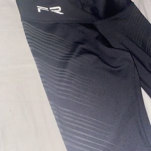 Fiber Leggings Black with rubberized feel  pattern along side of both legs.